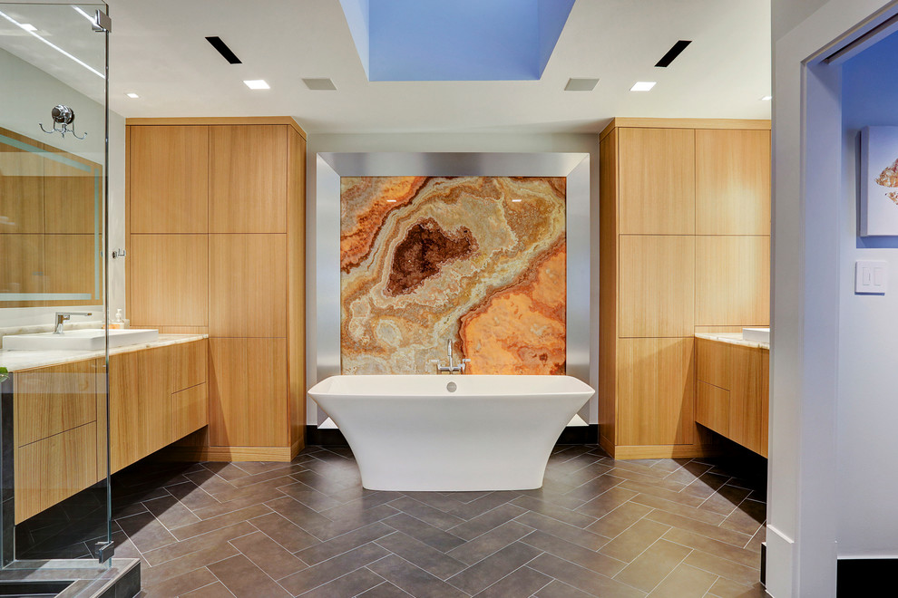 Bathroom - large contemporary master black tile and porcelain tile porcelain tile and black floor bathroom idea in Houston with flat-panel cabinets, brown cabinets, a drop-in sink, quartz countertops and white walls