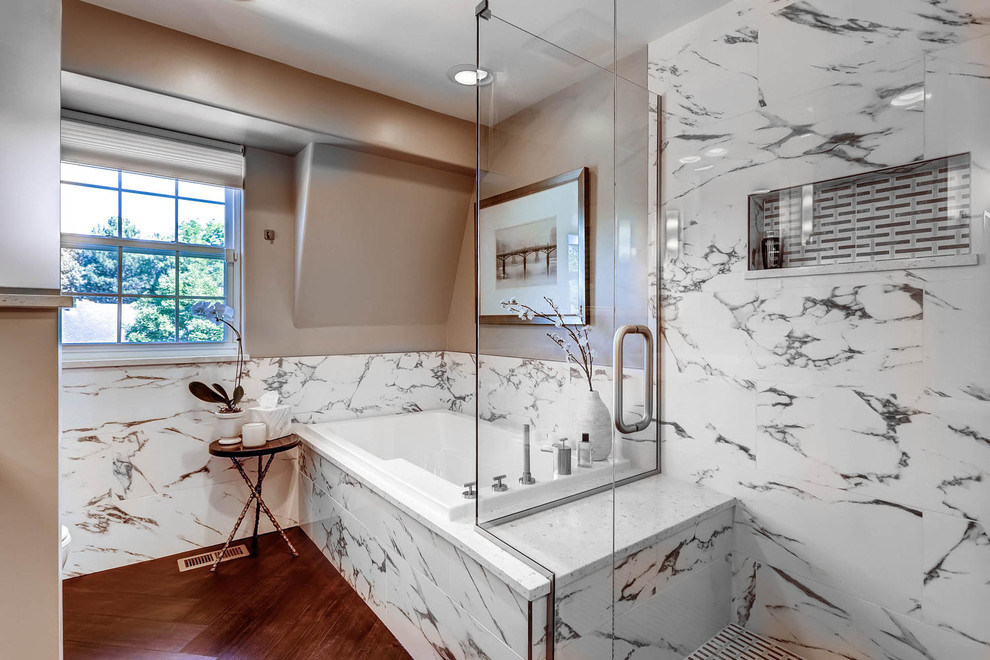 Inspiration for a large transitional white tile and porcelain tile dark wood floor bathroom remodel in Denver with a vessel sink, shaker cabinets, beige cabinets, quartz countertops, a two-piece toilet and beige walls
