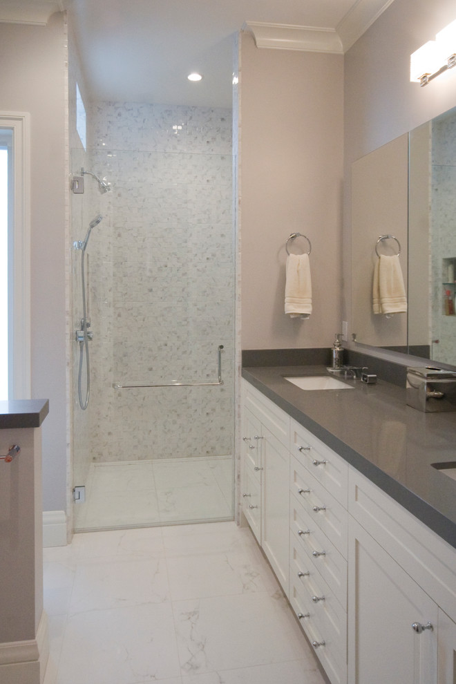 Walk-in shower - mid-sized transitional master marble floor walk-in shower idea in San Francisco with an undermount sink, recessed-panel cabinets, white cabinets, quartz countertops, a two-piece toilet and purple walls