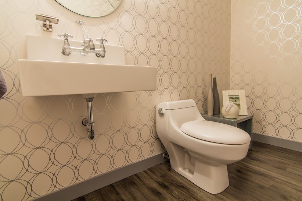 Medium sized modern cloakroom in Vancouver with open cabinets, grey cabinets, a one-piece toilet, beige walls, dark hardwood flooring, a wall-mounted sink, engineered stone worktops and brown floors.