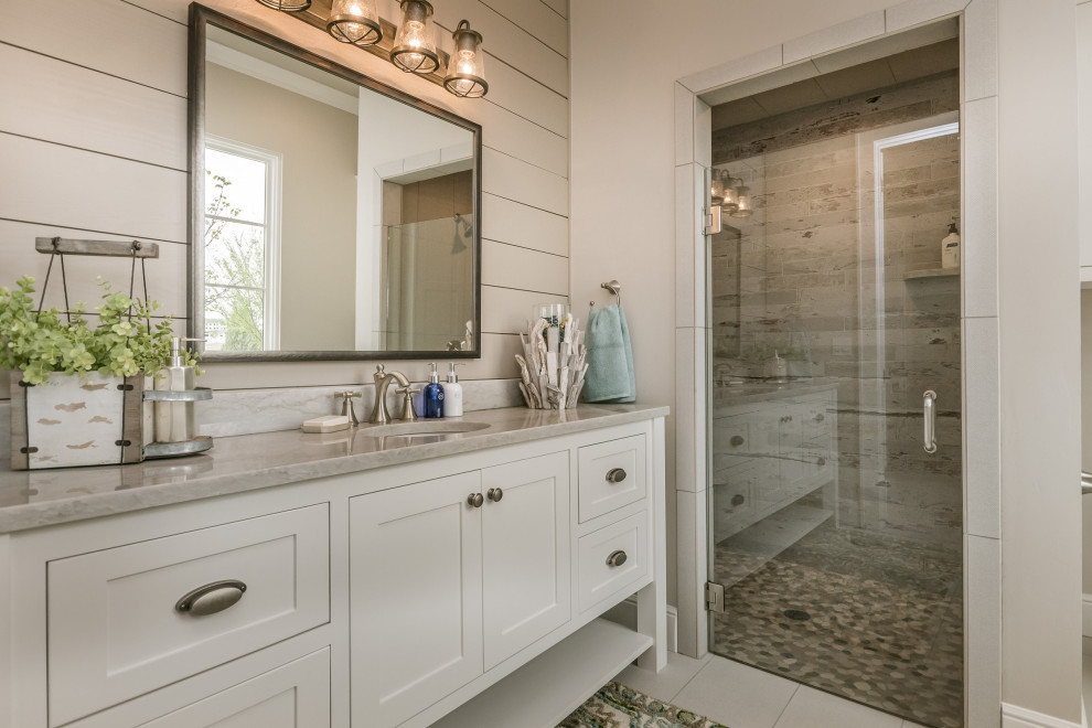 Farmhouse 3/4 multicolored tile white floor alcove shower photo in Austin with shaker cabinets, white cabinets, white walls, an undermount sink, a hinged shower door and gray countertops