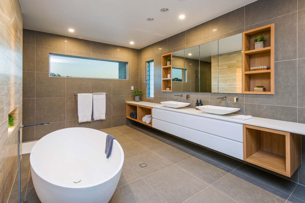 Inspiration for a large coastal master gray tile and porcelain tile single-sink double shower remodel in Gold Coast - Tweed with beaded inset cabinets, white cabinets, quartz countertops, white countertops and a floating vanity
