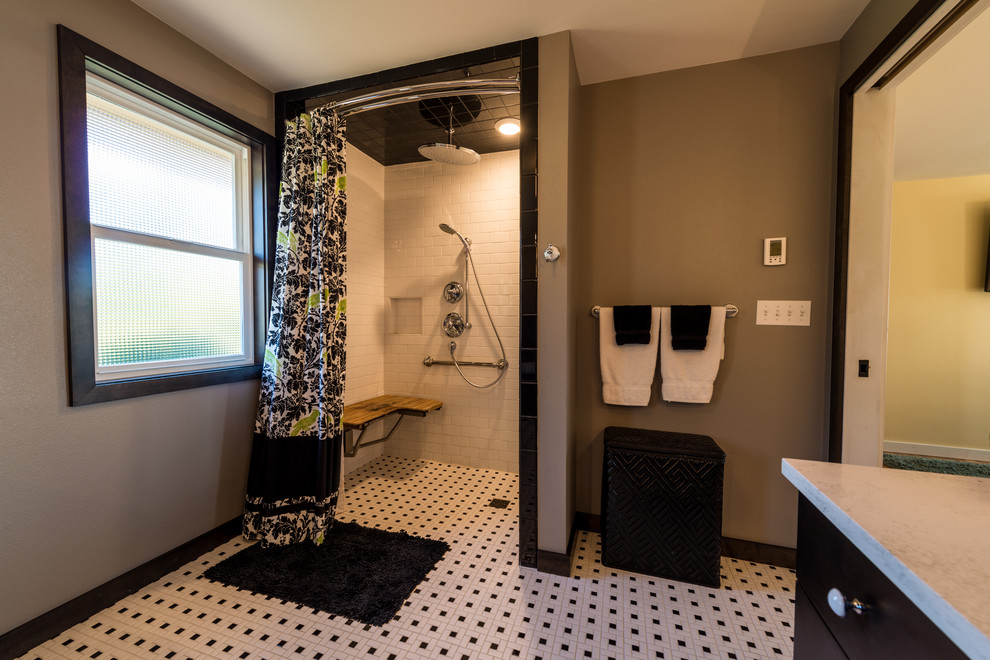 Inspiration for a large master black and white tile and ceramic tile ceramic tile bathroom remodel in Seattle with beaded inset cabinets, dark wood cabinets, a two-piece toilet, gray walls, an undermount sink and marble countertops