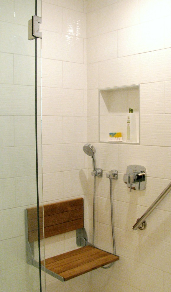 Photo of a medium sized traditional ensuite bathroom in Other with recessed-panel cabinets, medium wood cabinets, an alcove shower, a one-piece toilet, grey tiles, ceramic tiles, grey walls, ceramic flooring and engineered stone worktops.