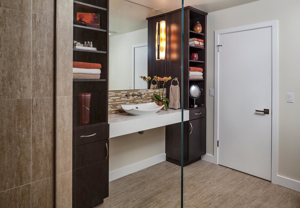 Example of a mid-sized trendy 3/4 multicolored tile and stone tile porcelain tile walk-in shower design in Seattle with a vessel sink, flat-panel cabinets, dark wood cabinets, quartz countertops, a one-piece toilet and beige walls