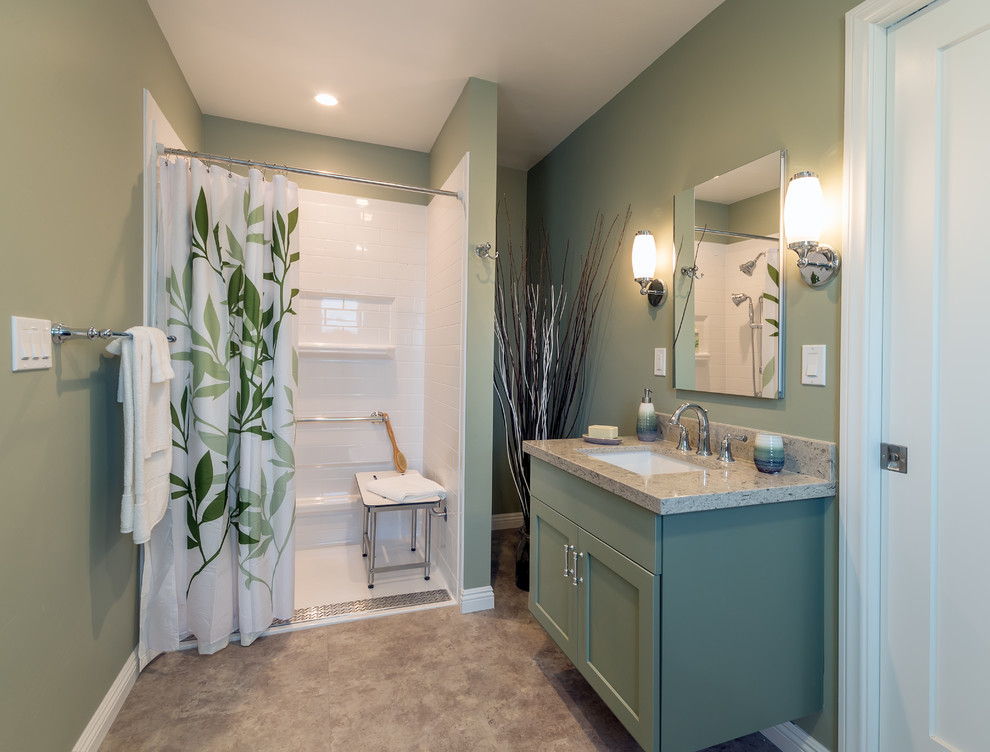 Mid-sized transitional master vinyl floor walk-in shower photo in San Diego with shaker cabinets, green cabinets, a one-piece toilet, green walls, an undermount sink and quartz countertops