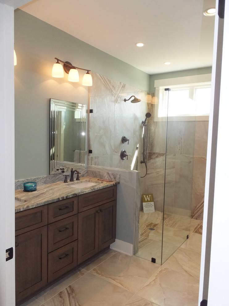 Large traditional ensuite bathroom in New York with shaker cabinets, medium wood cabinets, a corner shower, green walls, porcelain flooring, a submerged sink, beige floors and an open shower.