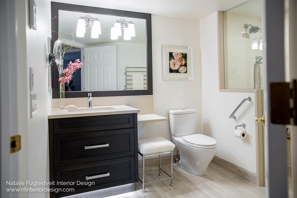 Example of a small minimalist beige tile and stone tile porcelain tile walk-in shower design in Calgary with recessed-panel cabinets, dark wood cabinets, a two-piece toilet, white walls, an undermount sink and quartz countertops