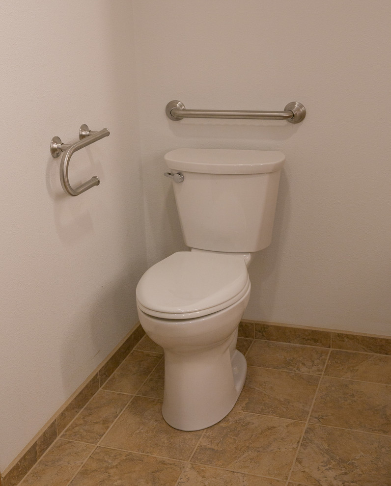 Example of a large transitional multicolored tile and porcelain tile porcelain tile and multicolored floor powder room design in Other with flat-panel cabinets, light wood cabinets, a two-piece toilet, white walls, an undermount sink and quartz countertops