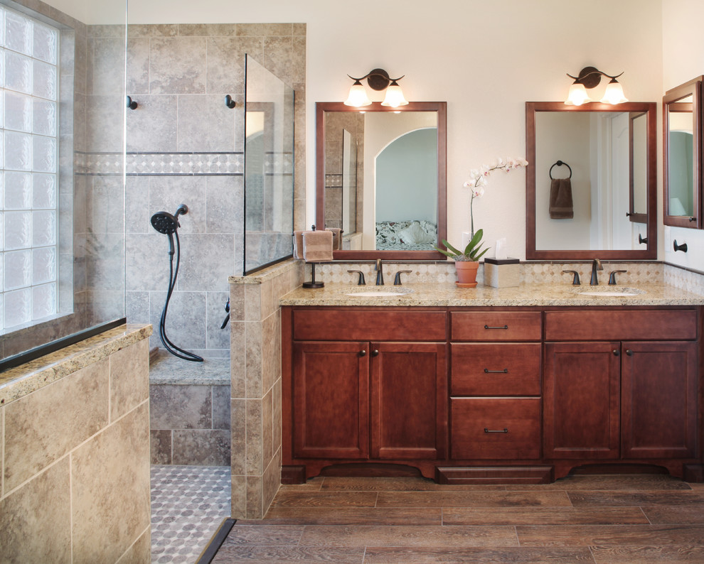 Inspiration for a mid-sized timeless master beige tile and porcelain tile porcelain tile walk-in shower remodel in Denver with an undermount sink, recessed-panel cabinets, dark wood cabinets, granite countertops, a two-piece toilet and white walls