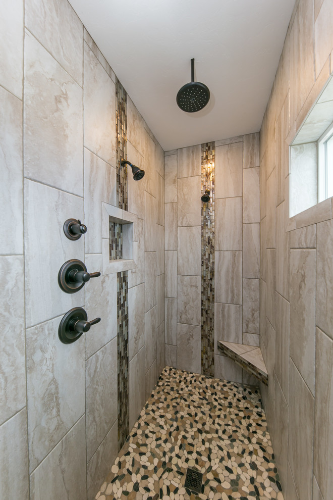 Bathroom - mid-sized transitional master brown tile and glass tile porcelain tile and beige floor bathroom idea in Seattle with shaker cabinets, dark wood cabinets, gray walls, an undermount sink and granite countertops