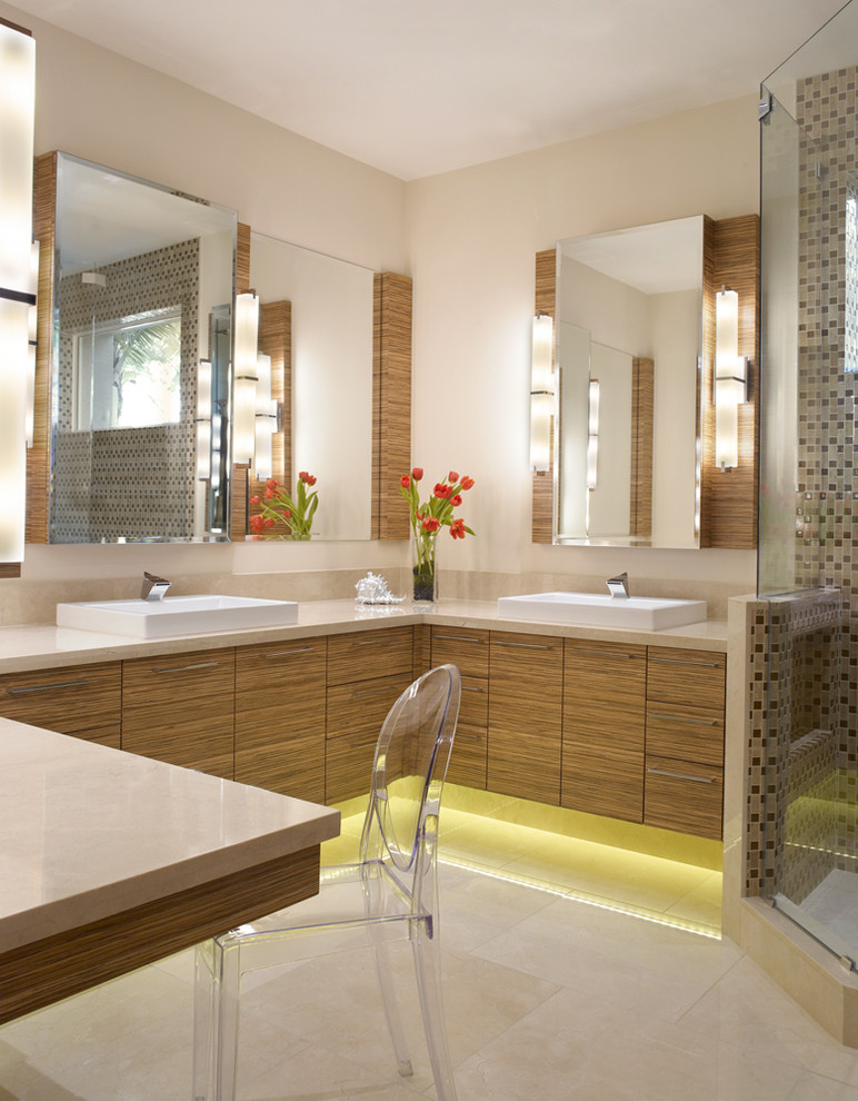 Corner shower - large contemporary master marble floor corner shower idea in Miami with a vessel sink, flat-panel cabinets and medium tone wood cabinets