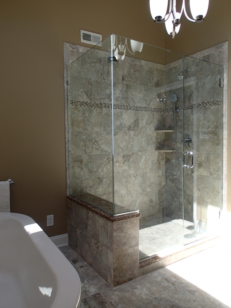 Design ideas for a medium sized traditional ensuite bathroom in Philadelphia with a submerged sink, shaker cabinets, dark wood cabinets, engineered stone worktops, a freestanding bath, a corner shower, a two-piece toilet, grey tiles, porcelain tiles, brown walls and porcelain flooring.