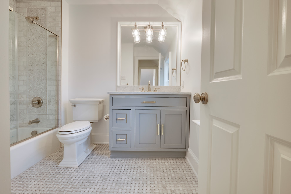 Design ideas for a small traditional family bathroom in Philadelphia with flat-panel cabinets, grey cabinets, a built-in bath, a corner shower, a one-piece toilet, multi-coloured tiles, marble tiles, white walls, marble flooring, marble worktops, multi-coloured floors and a sliding door.