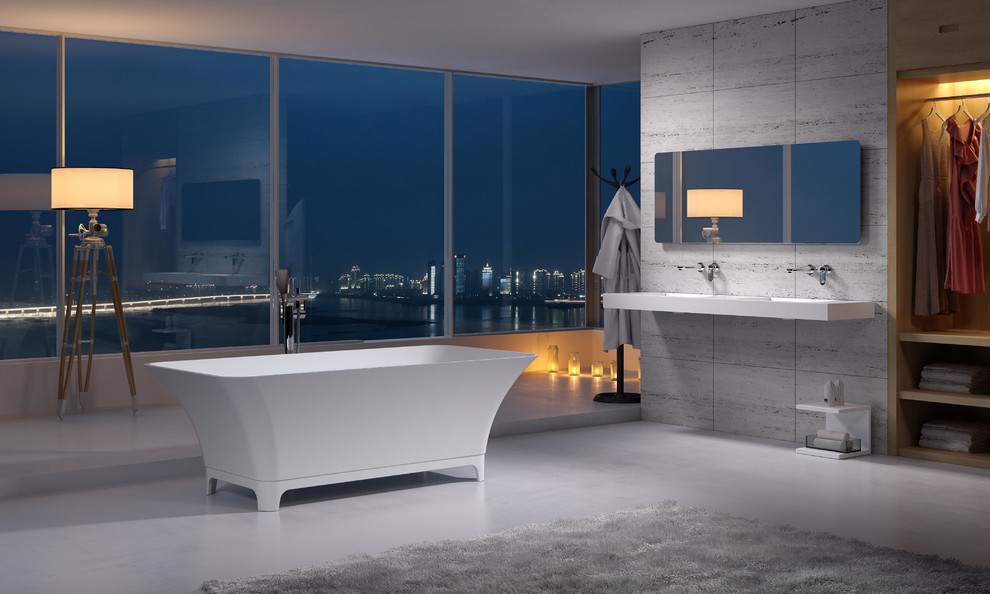 Example of a large trendy master gray floor freestanding bathtub design in Los Angeles with gray walls, a wall-mount sink, solid surface countertops and white countertops