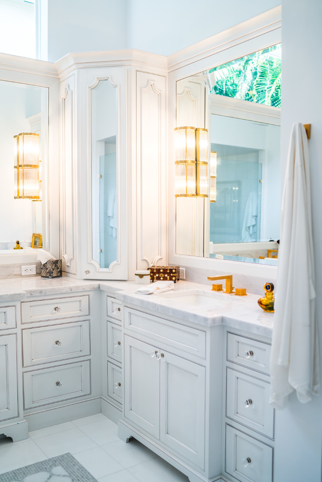 Contemporary ensuite wet room bathroom in Miami with recessed-panel cabinets, grey cabinets, a built-in bath, grey tiles, white tiles, grey walls, marble flooring, a submerged sink and marble worktops.