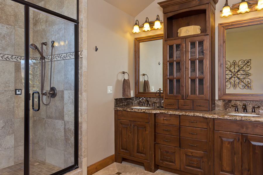 Double shower - mid-sized craftsman beige tile and ceramic tile ceramic tile double shower idea in Salt Lake City with an undermount sink, furniture-like cabinets, dark wood cabinets, granite countertops and beige walls
