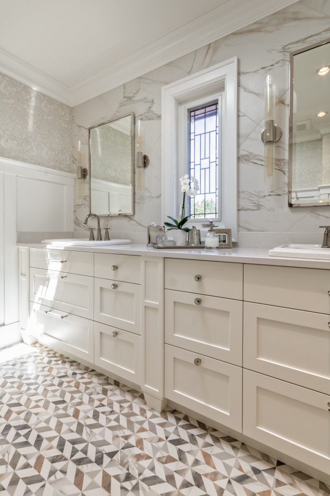 Inspiration for a small traditional ensuite bathroom in Vancouver with shaker cabinets, white cabinets, white tiles, porcelain tiles, a built-in sink, engineered stone worktops, white worktops, double sinks, a built in vanity unit, wallpapered walls, wainscoting and grey walls.