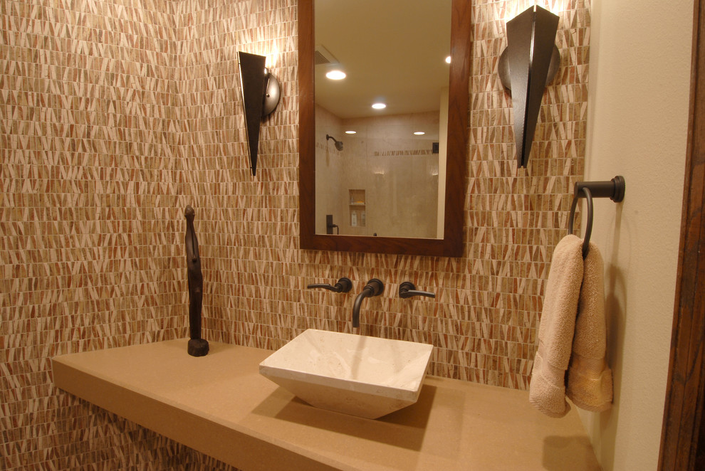 Minimalist beige tile and ceramic tile corner shower photo in Denver with a vessel sink, open cabinets, concrete countertops and a two-piece toilet