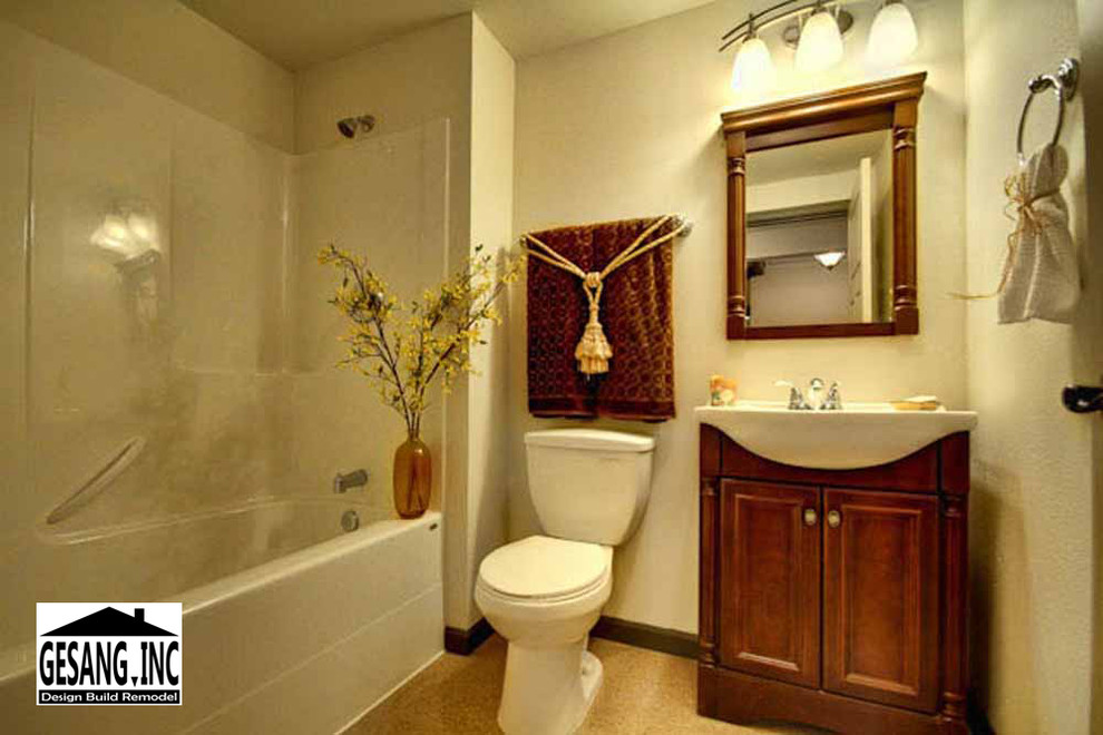 Inspiration for a small traditional shower room bathroom in Seattle with freestanding cabinets, dark wood cabinets, an alcove bath, a shower/bath combination, a two-piece toilet, beige tiles, beige walls, ceramic flooring and an integrated sink.
