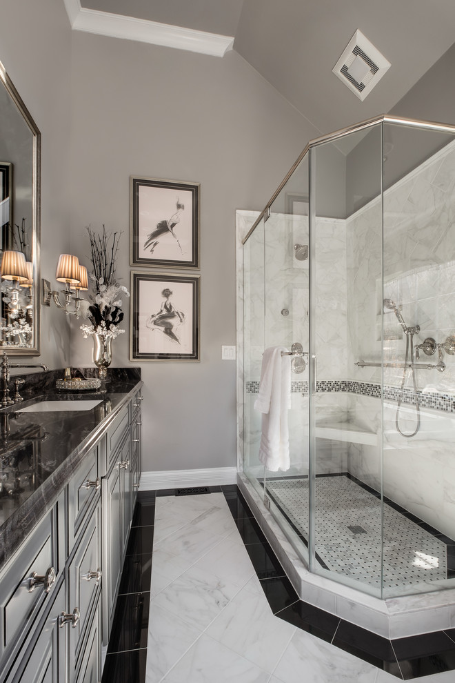 Photo of a medium sized classic shower room bathroom in Other with raised-panel cabinets, grey cabinets, a corner shower, a two-piece toilet, grey walls, marble flooring, a submerged sink and granite worktops.