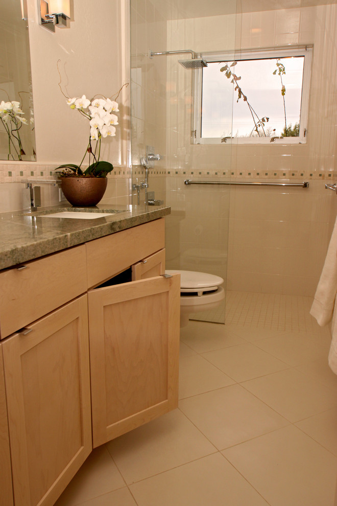 Example of a mid-sized classic 3/4 white tile ceramic tile alcove shower design in San Francisco with an undermount sink, shaker cabinets, light wood cabinets, a one-piece toilet and white walls