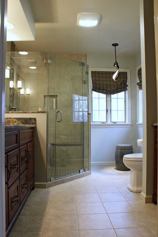 Design ideas for a medium sized classic ensuite bathroom in Philadelphia with raised-panel cabinets, dark wood cabinets, an alcove shower, a one-piece toilet, ceramic tiles, ceramic flooring and granite worktops.