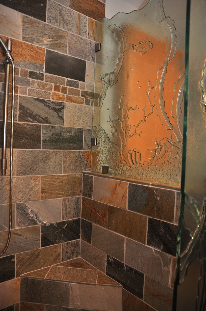 Example of a small transitional stone tile slate floor corner shower design in Seattle with a vessel sink, recessed-panel cabinets, light wood cabinets, granite countertops and blue walls