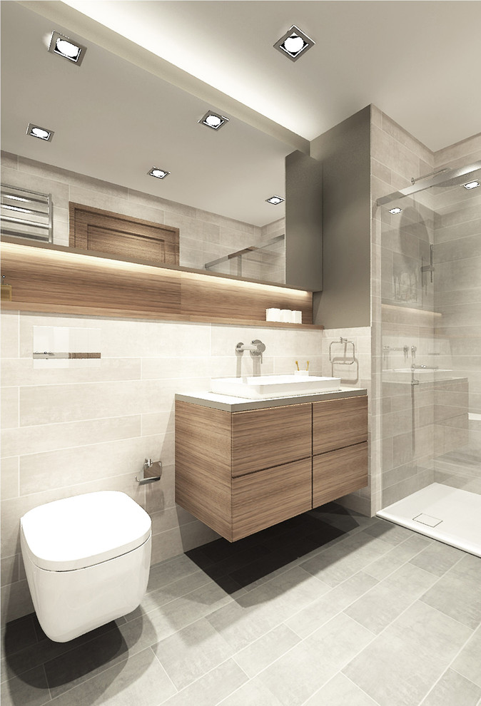 Inspiration pour une petite salle de bain minimaliste avec un placard à porte plane, un carrelage gris, des carreaux de céramique, un mur beige et un sol en carrelage de céramique.