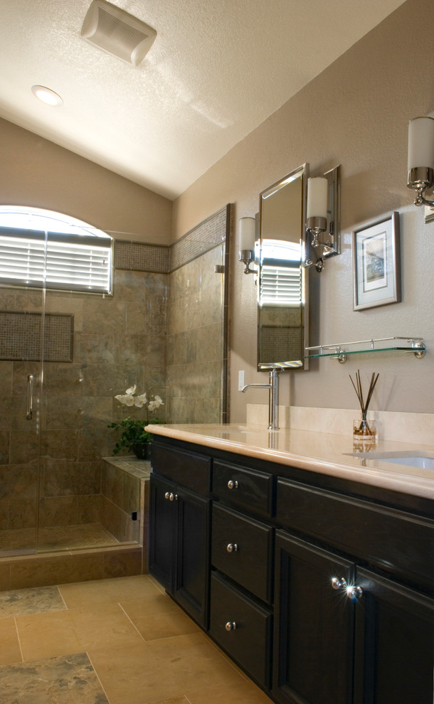 Example of a mid-sized trendy master bathroom design in San Francisco with raised-panel cabinets, black cabinets and limestone countertops