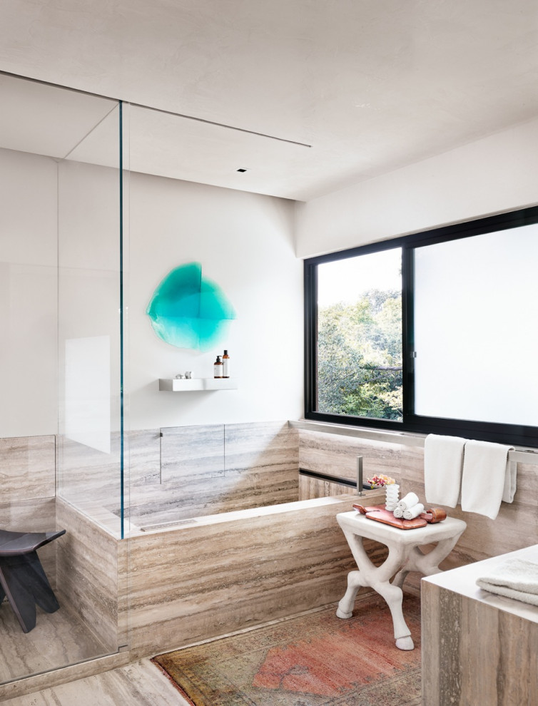 Medium sized contemporary ensuite wet room bathroom in Austin with flat-panel cabinets, brown cabinets, a built-in bath, a one-piece toilet, beige walls, a built-in sink, grey floors, a hinged door, grey worktops, a shower bench, a single sink and a built in vanity unit.