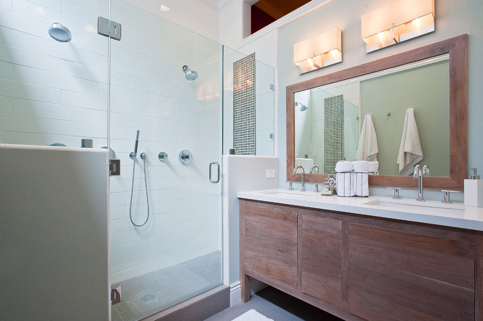 This is an example of a traditional bathroom in San Francisco with an alcove shower and feature lighting.