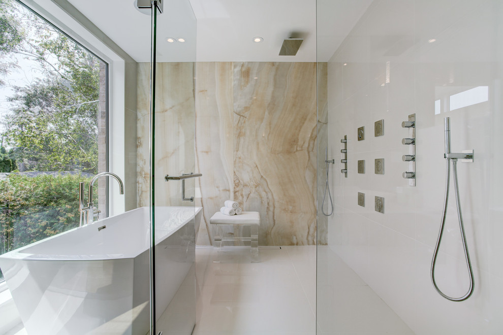 Example of a trendy white tile white floor bathroom design in Toronto with white walls and a hinged shower door