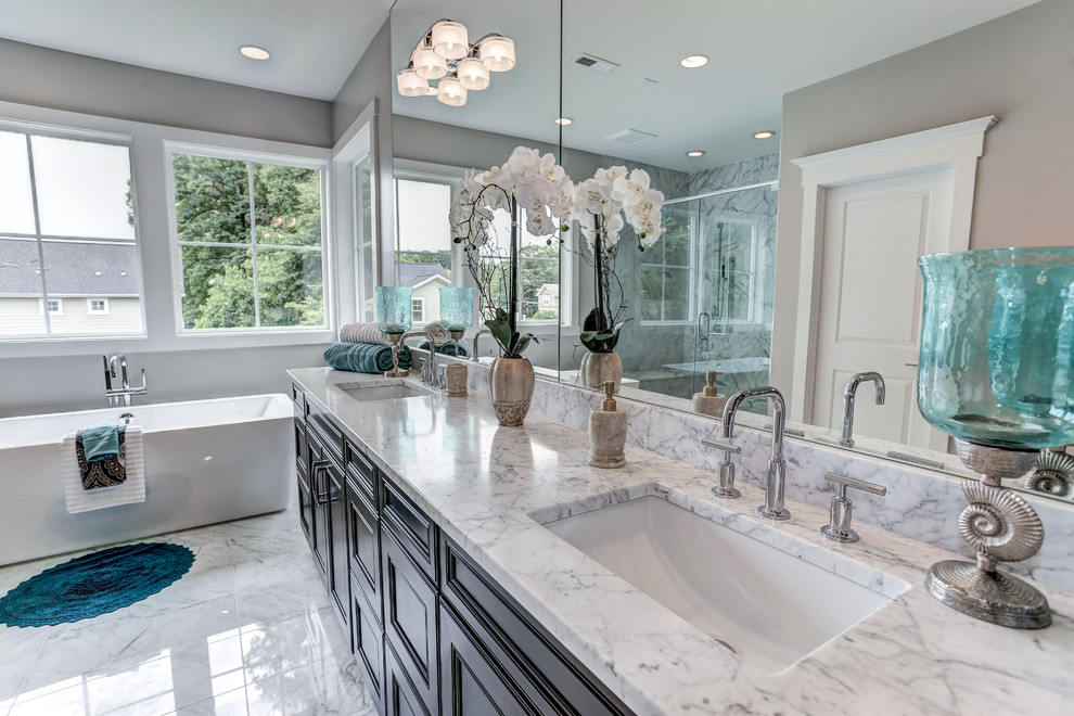 Mid-sized tuscan master gray tile and marble tile marble floor and white floor bathroom photo in DC Metro with louvered cabinets, brown cabinets, a two-piece toilet, gray walls, an undermount sink, quartz countertops and a hinged shower door