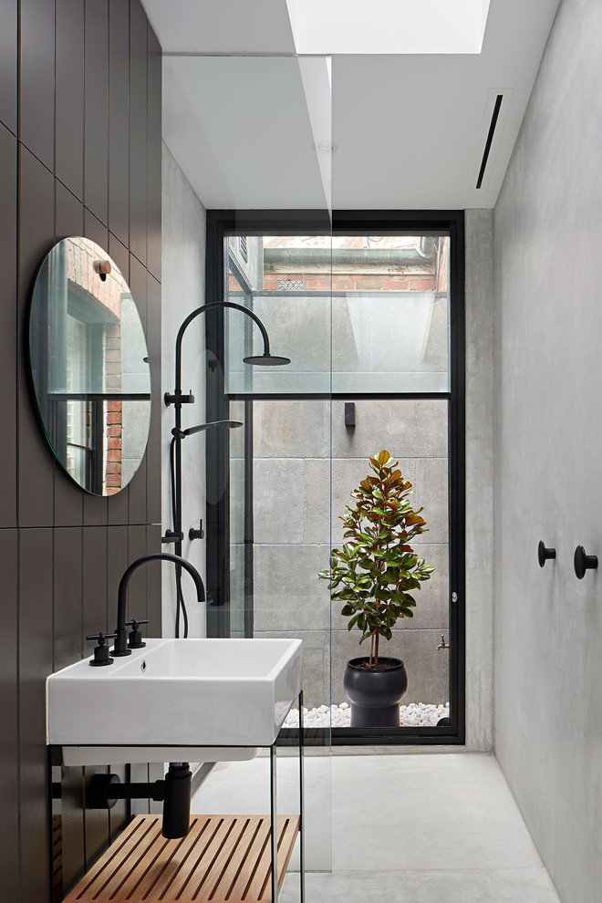 Inspiration for a contemporary 3/4 black tile white floor bathroom remodel in Sydney with open cabinets, an integrated sink and white countertops