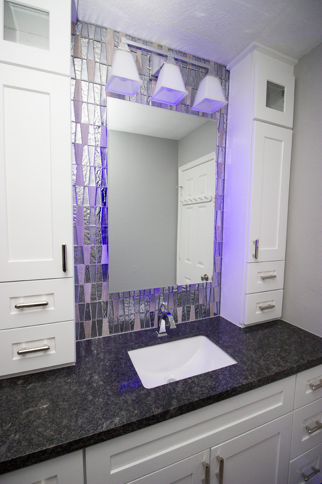 Inspiration for a small modern 3/4 multicolored tile and porcelain tile porcelain tile and gray floor bathroom remodel in Houston with shaker cabinets, white cabinets, an undermount sink, granite countertops, a two-piece toilet and black walls