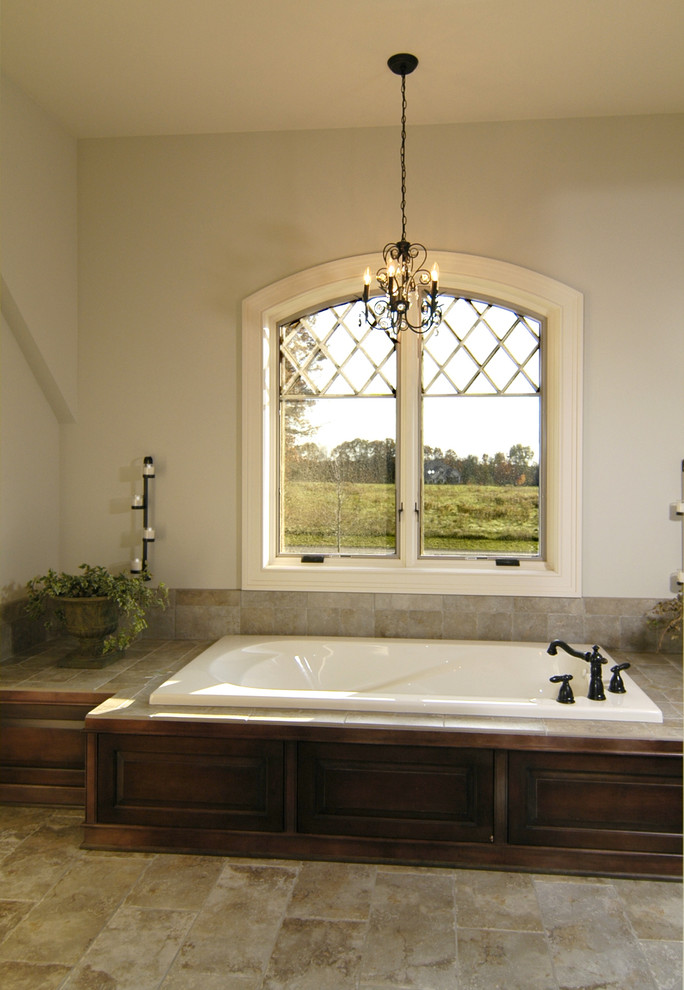 На фото: главная ванная комната в стиле кантри с темными деревянными фасадами, накладной ванной, белыми стенами, полом из керамической плитки и разноцветным полом