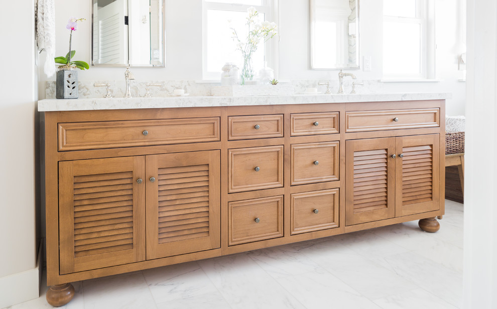 Example of a transitional master bathroom design in Santa Barbara with louvered cabinets and brown cabinets