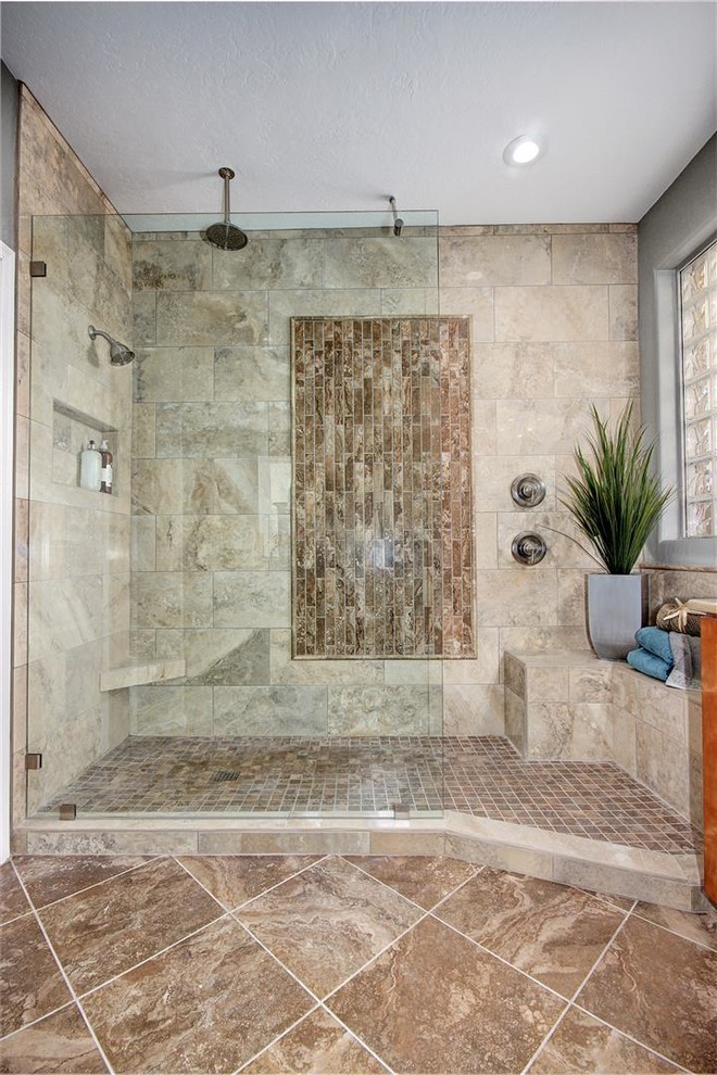 Photo of a large classic ensuite bathroom in Phoenix with shaker cabinets, medium wood cabinets, a walk-in shower, beige tiles, brown tiles, grey tiles, white tiles, porcelain tiles, grey walls, travertine flooring, a submerged sink and quartz worktops.