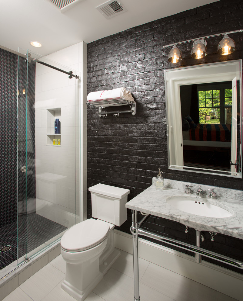 Example of a mid-sized cottage kids' black tile and pebble tile white floor and porcelain tile bathroom design in DC Metro with a two-piece toilet, black walls, a console sink and marble countertops