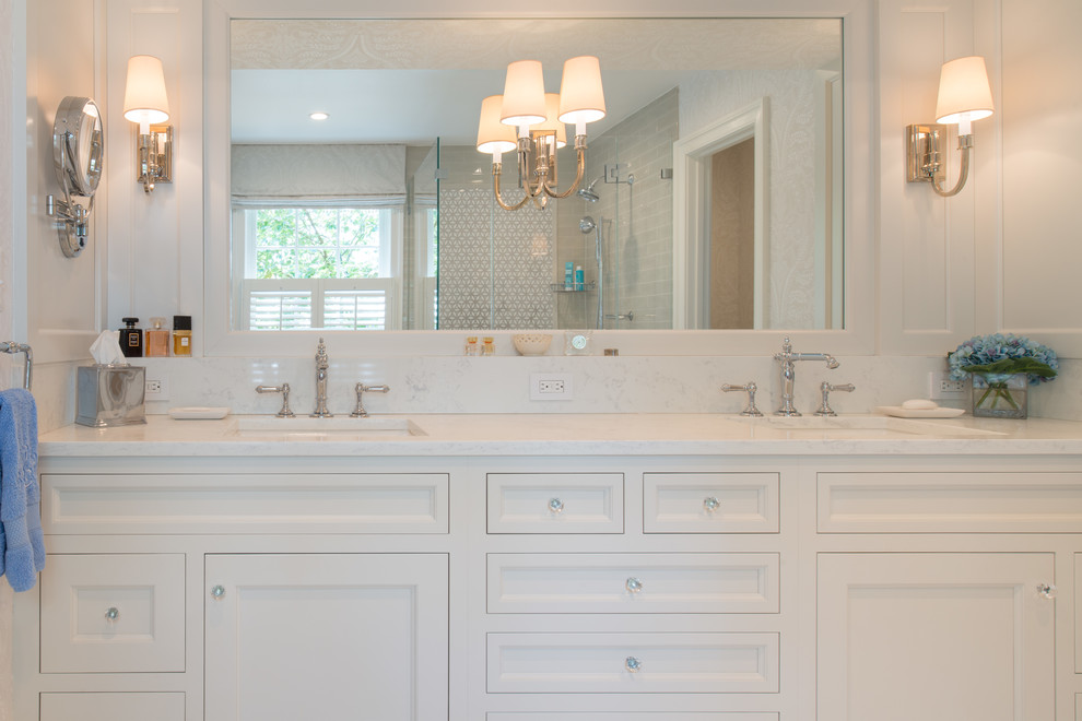 Inspiration for a mid-sized timeless master beige tile and mosaic tile ceramic tile and white floor corner shower remodel in DC Metro with beaded inset cabinets, white cabinets, a one-piece toilet, beige walls, an integrated sink, quartzite countertops and a hinged shower door