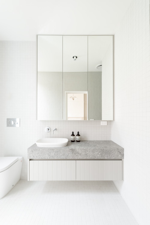 Airy All-White: Stone Countertops and Floating Vanity for Scandinavian Bathroom Ideas