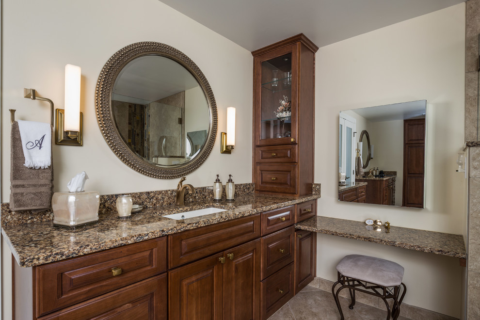 Photo of a large classic ensuite bathroom in DC Metro with raised-panel cabinets, dark wood cabinets, a built-in bath, a walk-in shower, a two-piece toilet, beige tiles, mosaic tiles, beige walls, ceramic flooring, a submerged sink and engineered stone worktops.