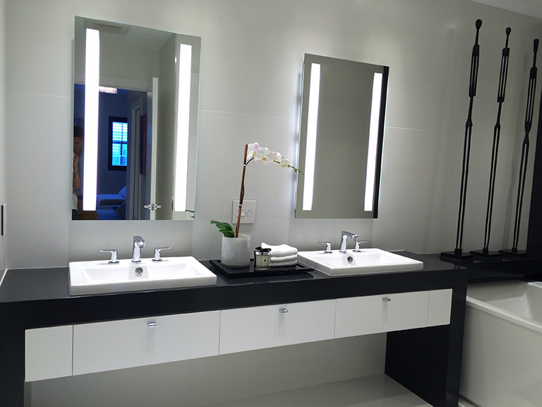 Design ideas for a medium sized modern bathroom in Miami with a submerged sink, flat-panel cabinets, dark wood cabinets, wooden worktops, a freestanding bath, a wall mounted toilet, white tiles, porcelain tiles, white walls and porcelain flooring.