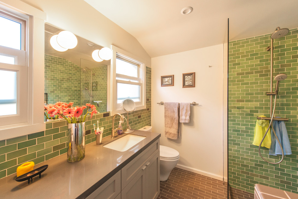 Photo of a small traditional ensuite bathroom in Los Angeles with a submerged sink, shaker cabinets, grey cabinets, engineered stone worktops, a built-in shower, a one-piece toilet, green tiles, ceramic tiles, white walls, ceramic flooring and grey worktops.