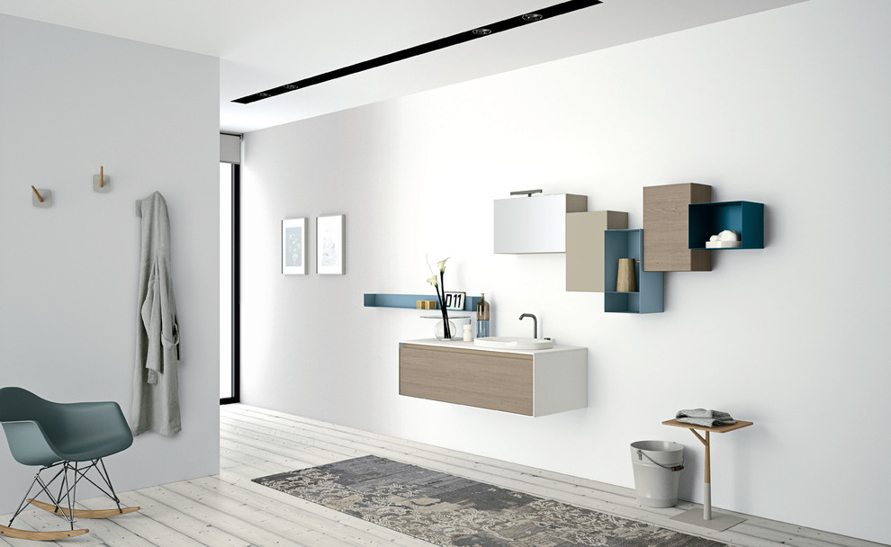 Mid-sized minimalist master bathroom photo in Toronto with flat-panel cabinets, light wood cabinets and an integrated sink