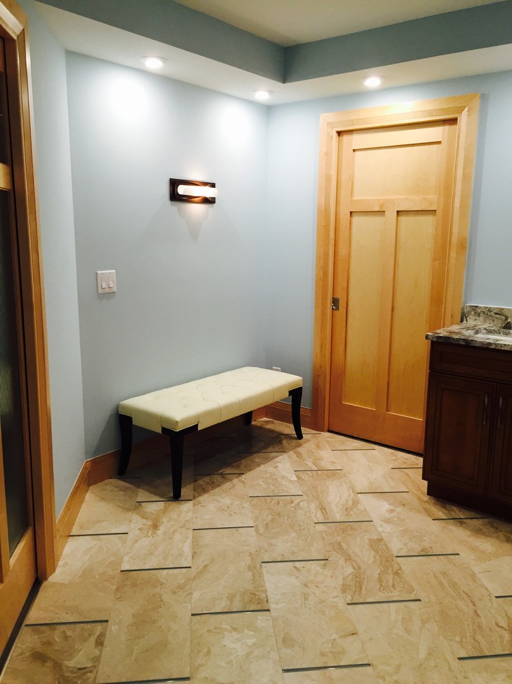 Photo of a large classic ensuite bathroom in Miami with a submerged sink, shaker cabinets, medium wood cabinets, granite worktops, a built-in shower, a two-piece toilet, beige tiles, porcelain tiles, blue walls and marble flooring.