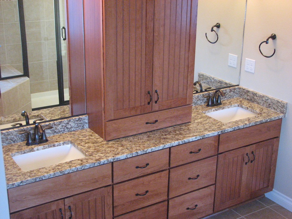 This is an example of a modern ensuite bathroom in Other with a submerged sink, shaker cabinets, medium wood cabinets, laminate worktops, beige tiles, porcelain tiles, black walls and porcelain flooring.