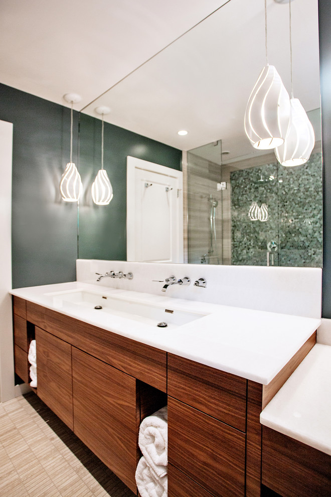 Medium sized contemporary ensuite bathroom in Toronto with a trough sink, flat-panel cabinets, medium wood cabinets, marble worktops, a corner shower, a one-piece toilet, grey tiles, mosaic tiles, blue walls and limestone flooring.