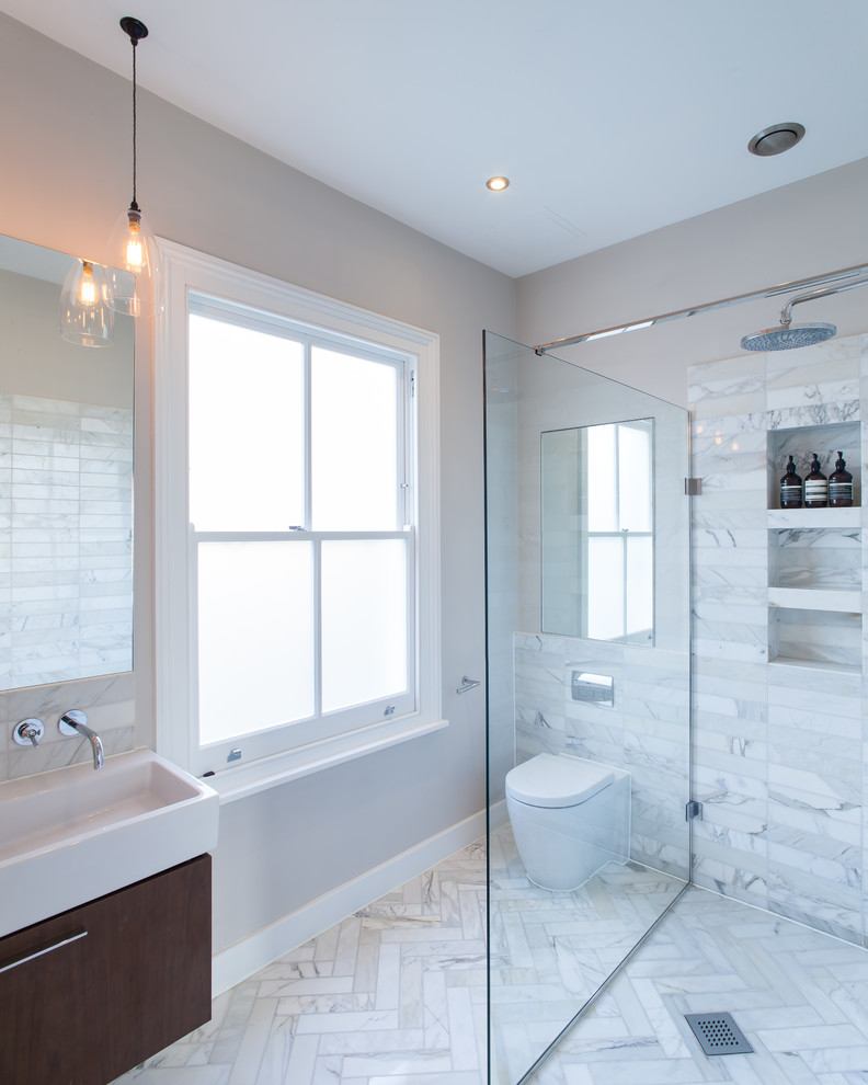 Design ideas for a medium sized contemporary bathroom in London with white tiles, marble tiles, white walls, marble flooring, a console sink, white floors, an open shower, flat-panel cabinets, brown cabinets and a one-piece toilet.